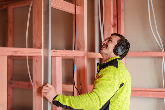 Builder wearing hi vis and earmuffs